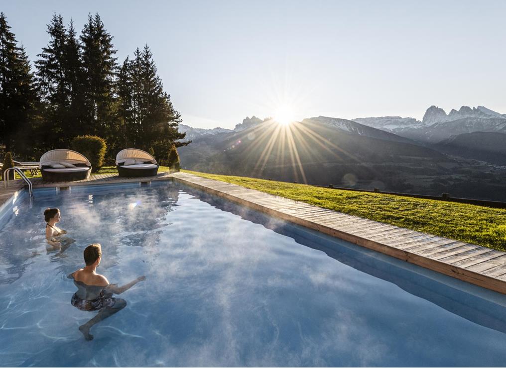 Two guests in the panoramic outdoor pool