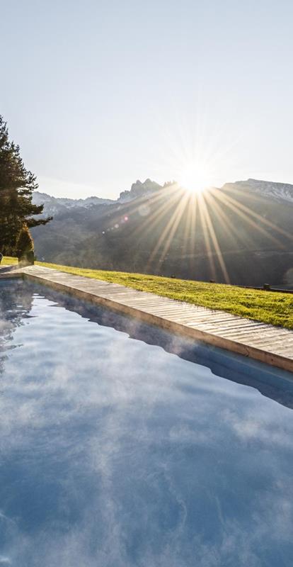 Two guests in the panoramic outdoor pool