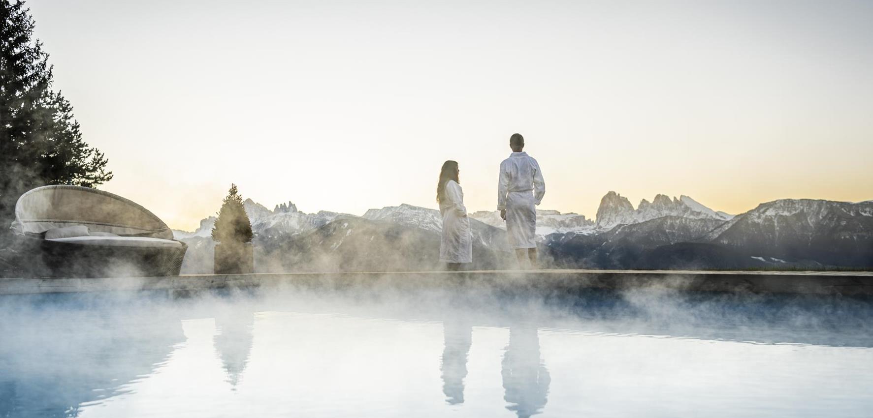 Two guests at the heated outdoor pool