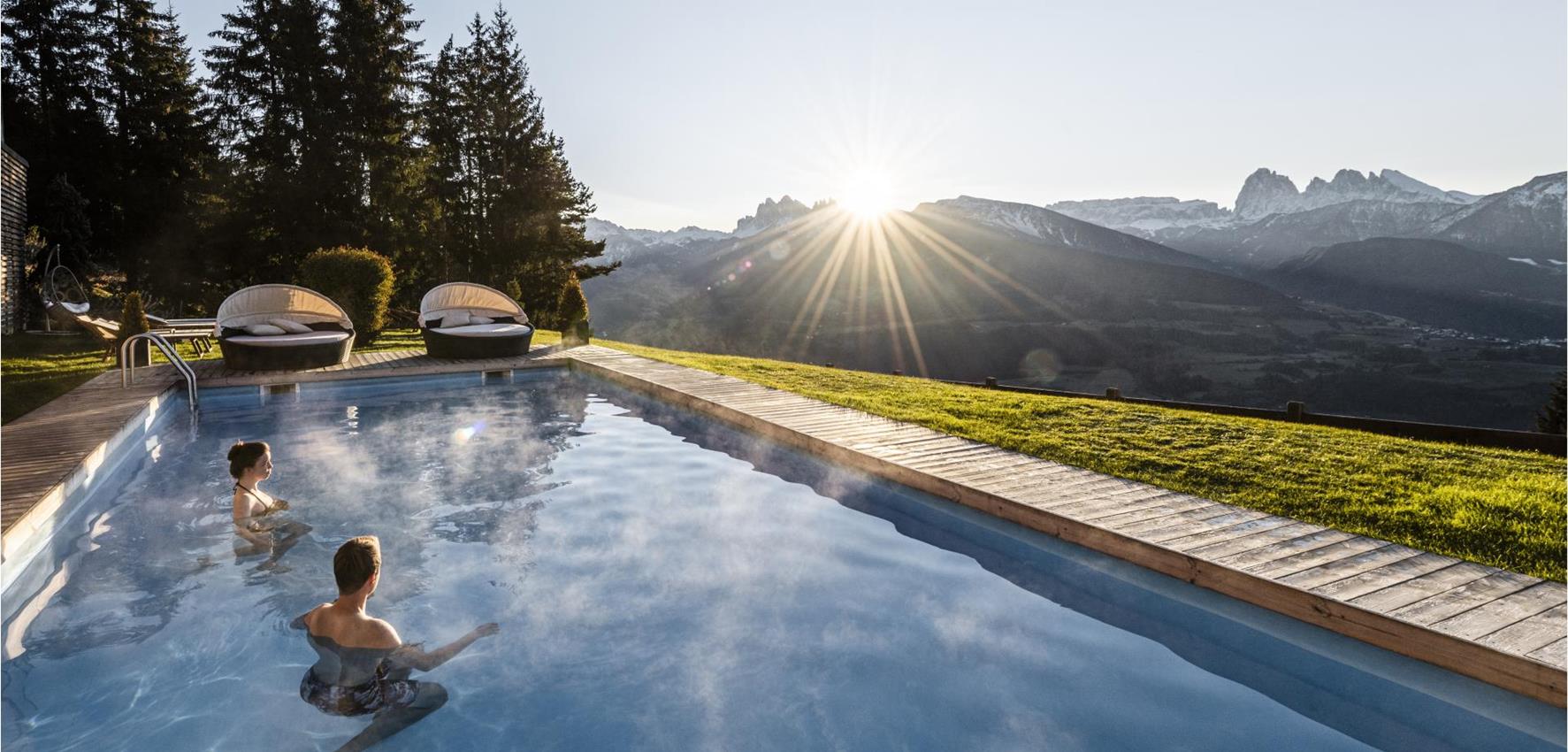 Two guests in the panoramic outdoor pool